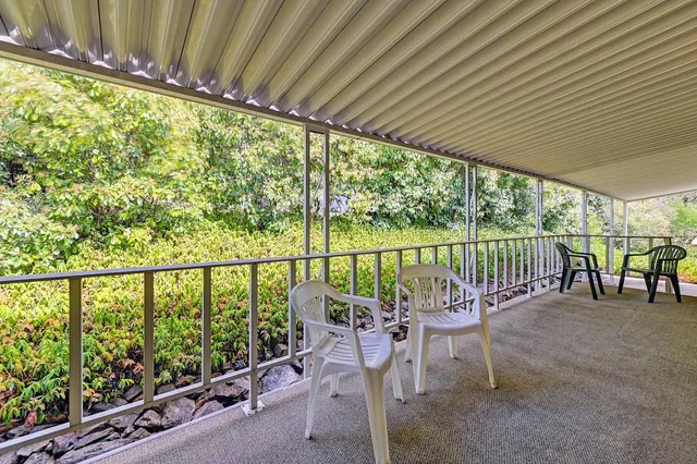 a room with a window and a chair