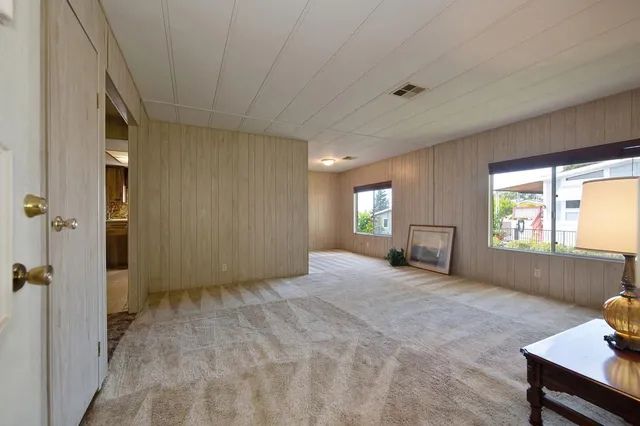 a view of an empty room and window