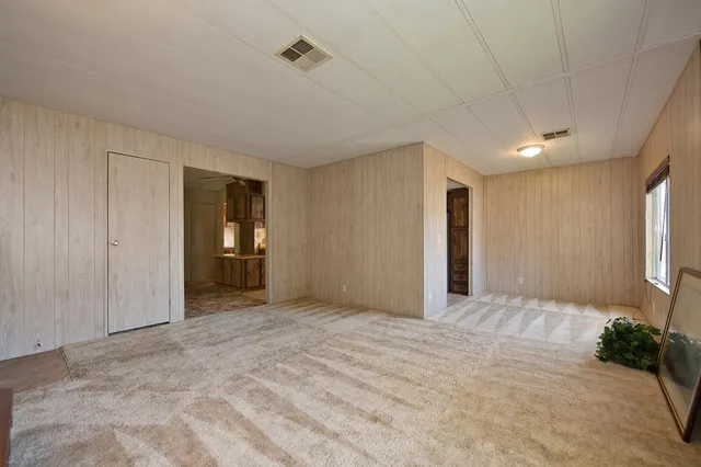 a bedroom with a bed and a chair