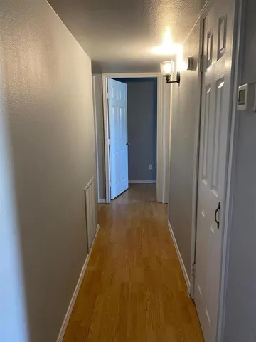 a view of hallway with shower