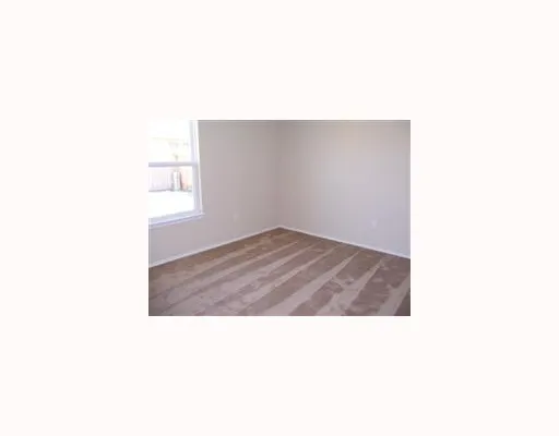 a open kitchen with a white and white wall