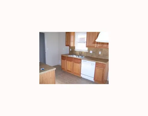 a open kitchen with granite countertop a sink and a stove
