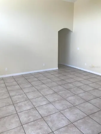 a view of an empty room and a window