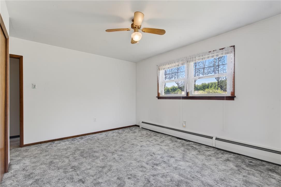62 Stoney Road Tamaqua, PA 18252 - Photo 29 of 61 A well-proportioned bedroom with ample natural light, featuring plush carpeting and a convenient ceiling fan.