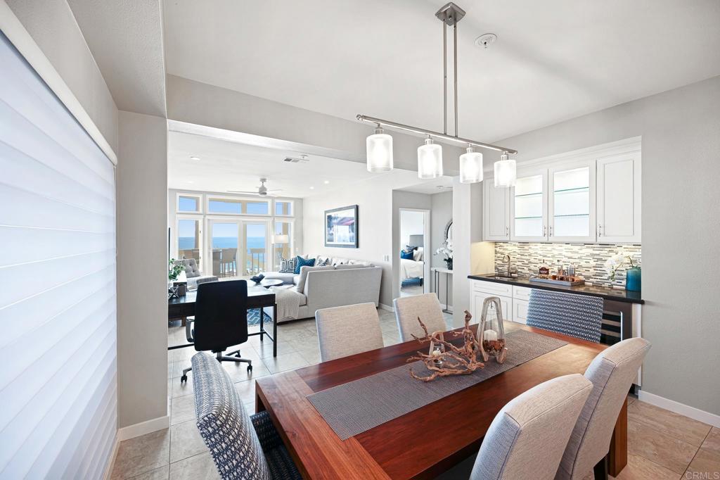 111 Sequoia Avenue, Unit C Carlsbad, CA 92008 - Photo 12 of 38 a view of a dining room with furniture window and wooden floor