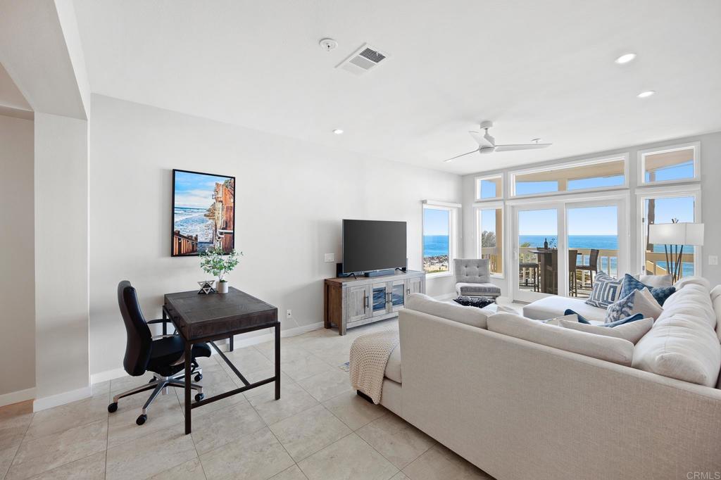 111 Sequoia Avenue, Unit C Carlsbad, CA 92008 - Photo 16 of 38 a living room with furniture and a flat screen tv
