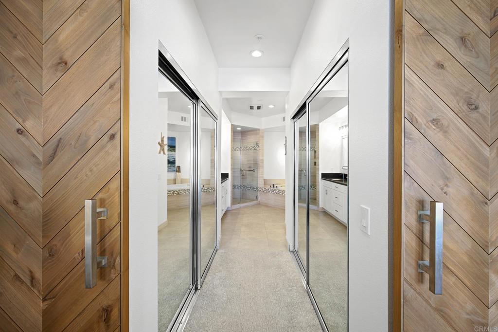 111 Sequoia Avenue, Unit C Carlsbad, CA 92008 - Photo 19 of 38 a view of a hallway with wooden floor and staircase