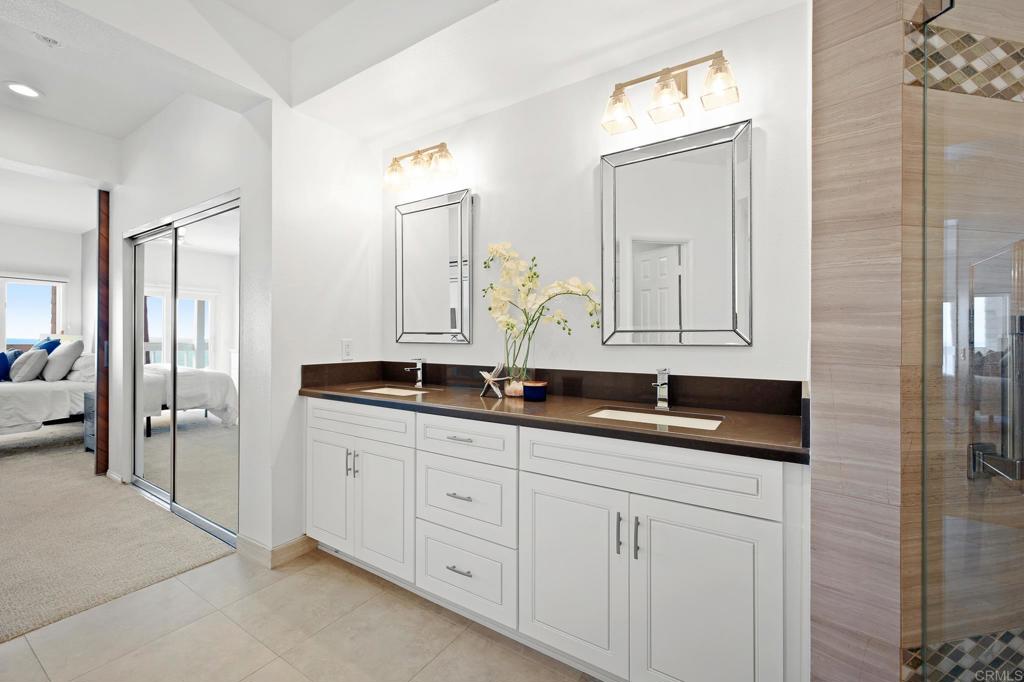111 Sequoia Avenue, Unit C Carlsbad, CA 92008 - Photo 20 of 38 a bathroom with double sink and a mirror
