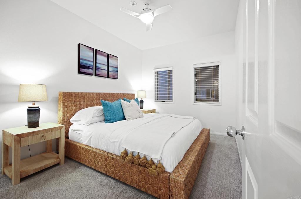 111 Sequoia Avenue, Unit C Carlsbad, CA 92008 - Photo 24 of 38 a bedroom with a bed and a night stand