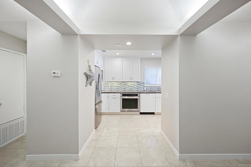 111 Sequoia Avenue, Unit C Carlsbad, CA 92008 - Photo 6 of 38 a view of a kitchen with a sink and a stove top oven