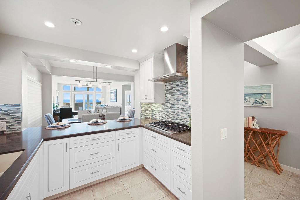 111 Sequoia Avenue, Unit C Carlsbad, CA 92008 - Photo 7 of 38 a hall with white cabinets and sink