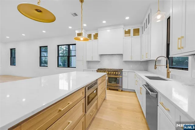 a view of kitchen and refrigerator