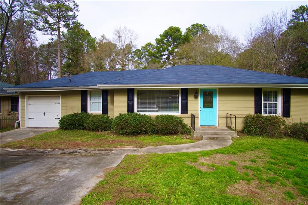 1908 Donna Place Decatur, GA 30032 - Photo 1 of 1 a view of a house with a yard