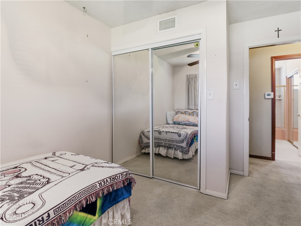 10930 Rio Hondo Drive Downey, CA 90241 - Photo 20 of 30 a bedroom with a bed and a mirror
