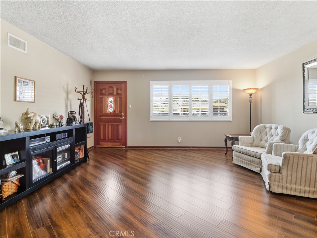 10930 Rio Hondo Drive Downey, CA 90241 - Photo 3 of 30 a view of livingroom with furniture and wooden floor