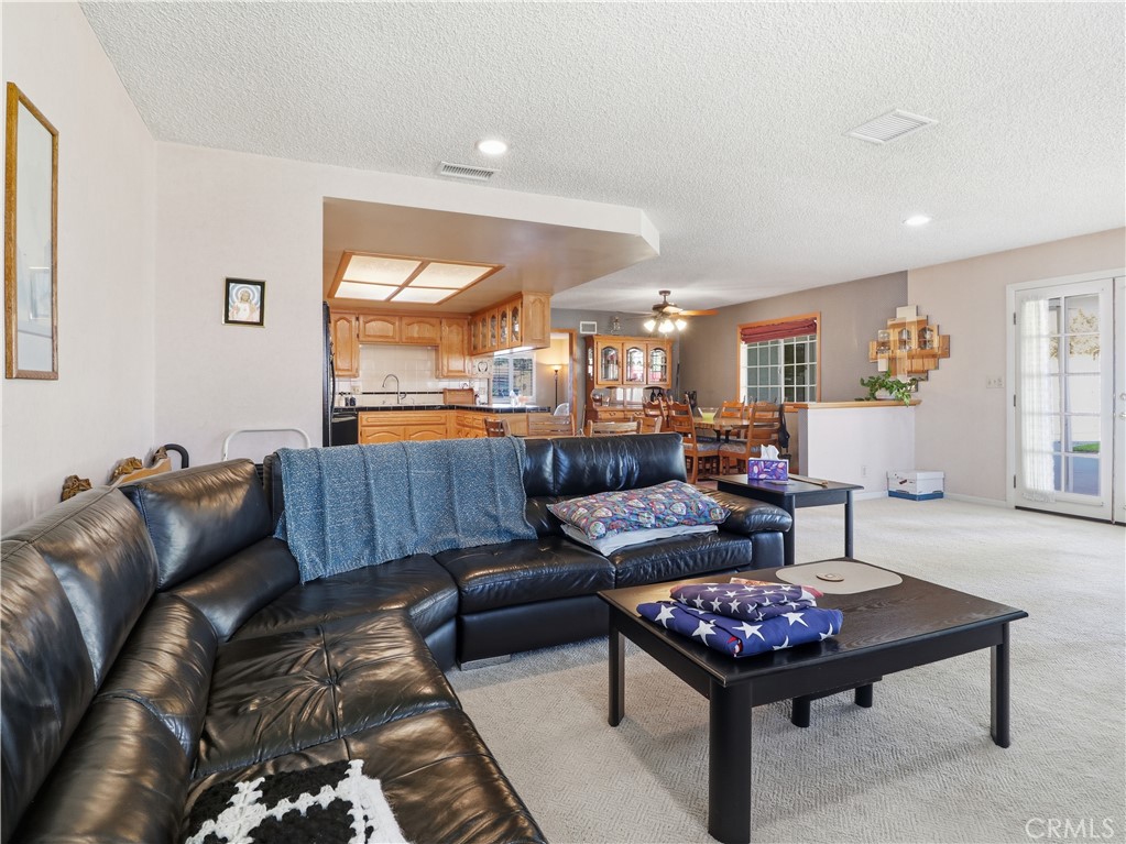 10930 Rio Hondo Drive Downey, CA 90241 - Photo 7 of 30 a living room with furniture and a large window