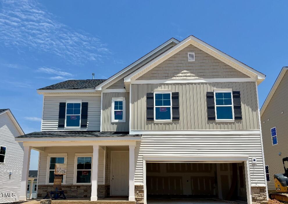 1213 Jade Vly Trail Raleigh, NC 27610 - Photo 1 of 20 a front view of a house with a garage