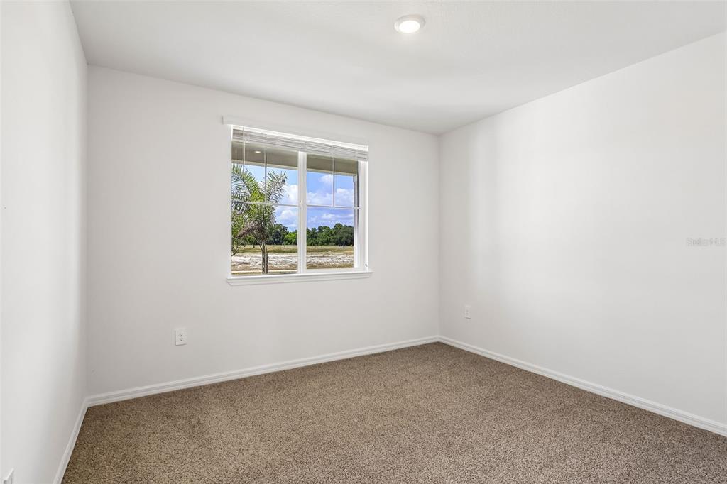 3335 Orchard Loop Bartow, FL 33830 - Photo 16 of 47 an empty room with a window