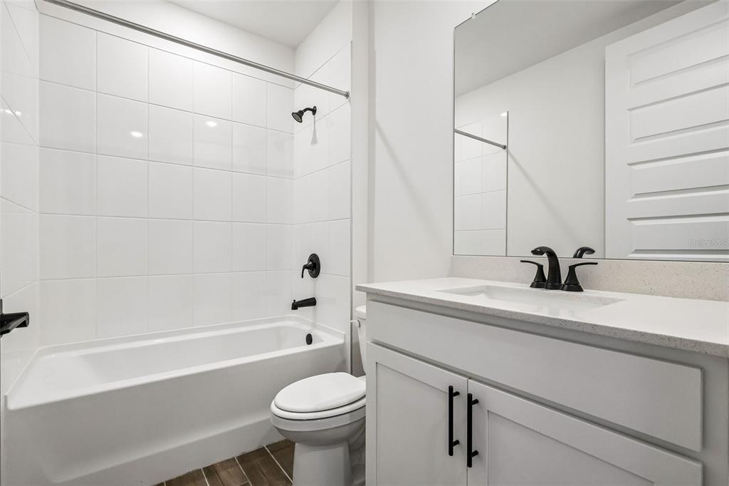 3335 Orchard Loop Bartow, FL 33830 - Photo 20 of 47 a bathroom with a sink a toilet and a bathtub