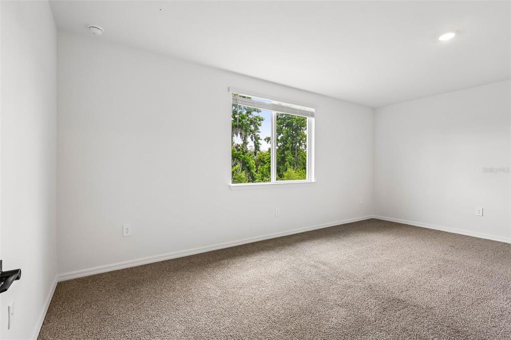 3335 Orchard Loop Bartow, FL 33830 - Photo 25 of 47 an empty room with windows