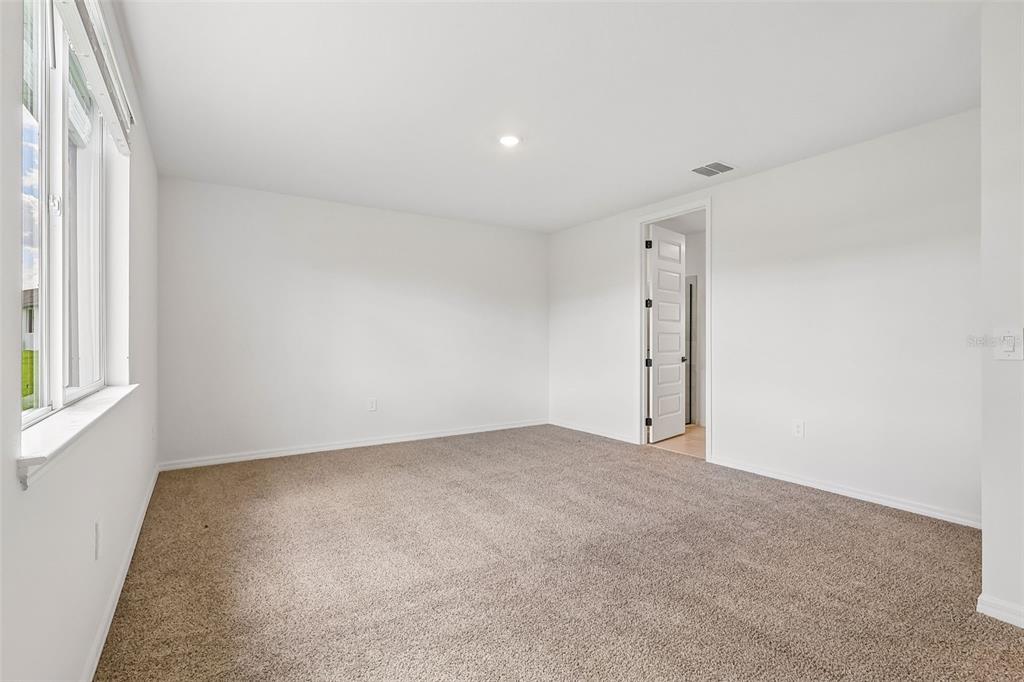 3335 Orchard Loop Bartow, FL 33830 - Photo 26 of 47 an empty room with windows
