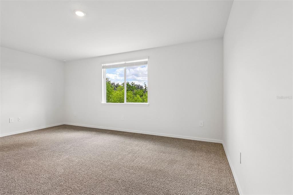 3335 Orchard Loop Bartow, FL 33830 - Photo 27 of 47 an empty room with windows