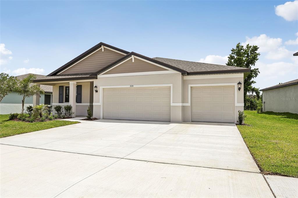 3335 Orchard Loop Bartow, FL 33830 - Photo 3 of 47 a front view of house with yard and green space