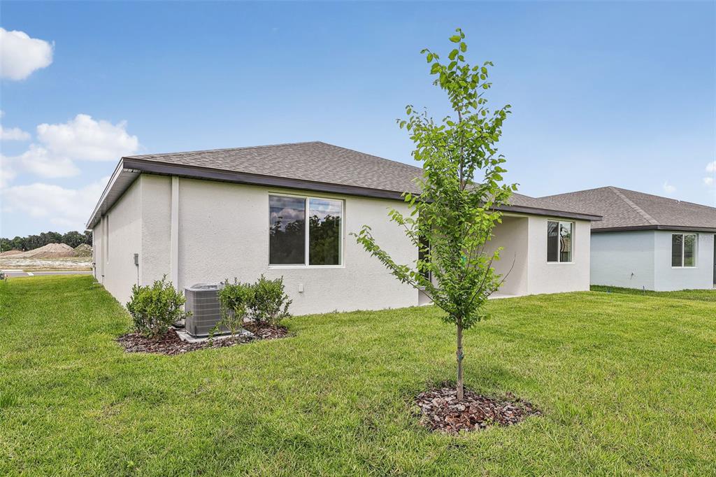3335 Orchard Loop Bartow, FL 33830 - Photo 31 of 47 a house that has a tree in it