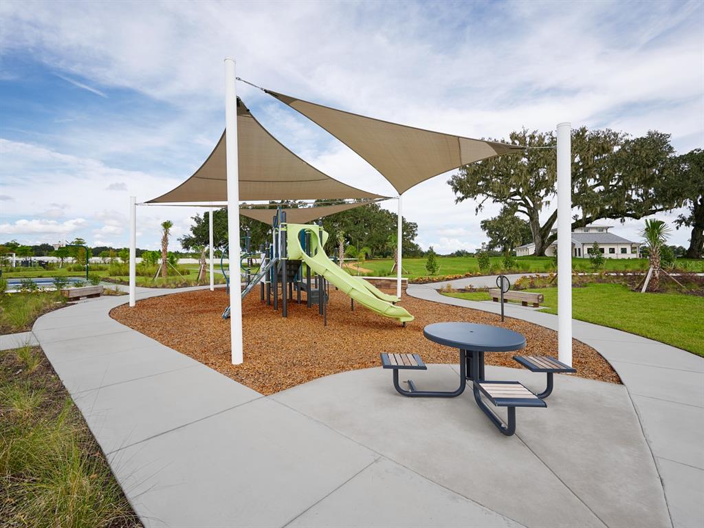 3335 Orchard Loop Bartow, FL 33830 - Photo 43 of 47 a view of a patio with a table and chairs