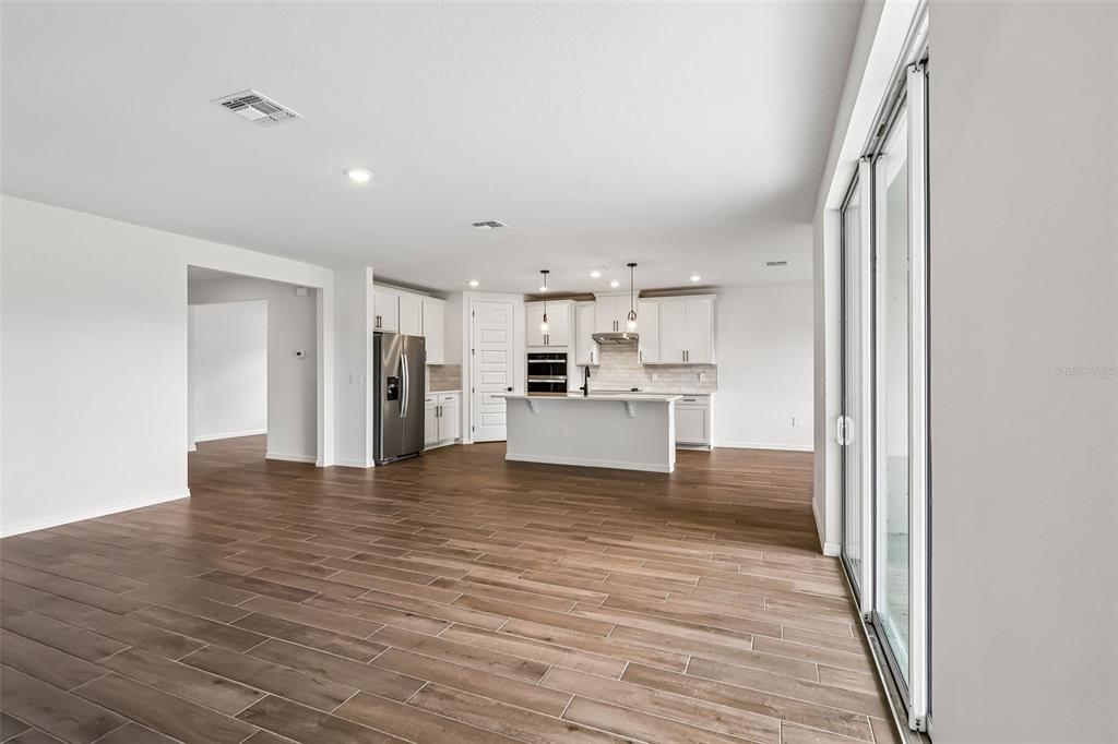 3335 Orchard Loop Bartow, FL 33830 - Photo 10 of 47 a view of kitchen view wooden floor and window