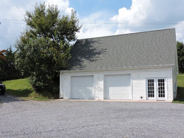 83 Willow Spout Road Fort Defiance, VA 24437 - Photo 38 of 48 a front view of a house with a yard and garage