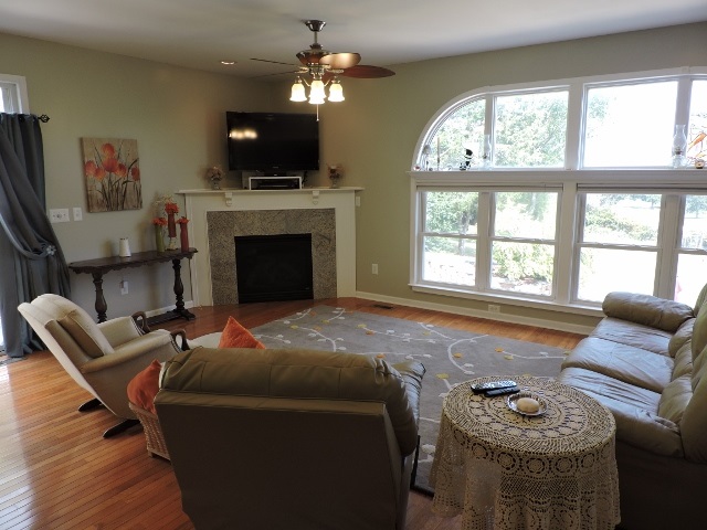83 Willow Spout Road Fort Defiance, VA 24437 - Photo 5 of 48 a living room with furniture a fireplace and a flat screen tv