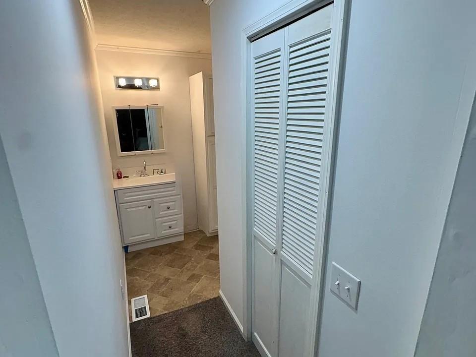 781 Thomas Street Roopville, GA 30170 - Photo 10 of 14 a bathroom with a toilet sink and mirror