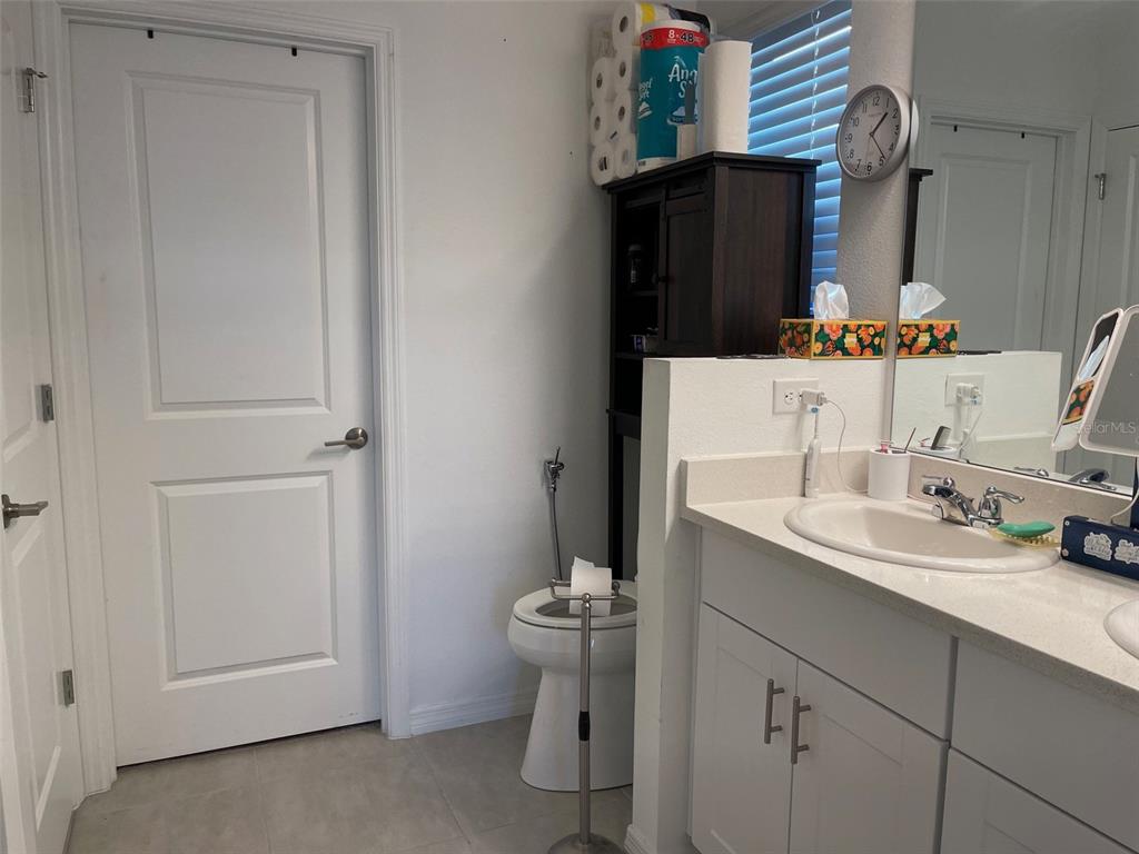 365 River Front Way Edgewater, FL 32141 - Photo 16 of 34 a bathroom with a sink and a mirror
