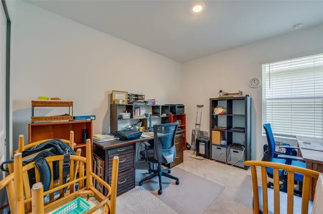 a view of a workspace with furniture and toys