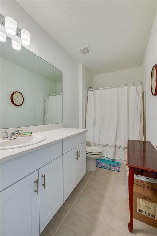 365 River Front Way Edgewater, FL 32141 - Photo 19 of 34 a bathroom with a sink a vanity and a mirror