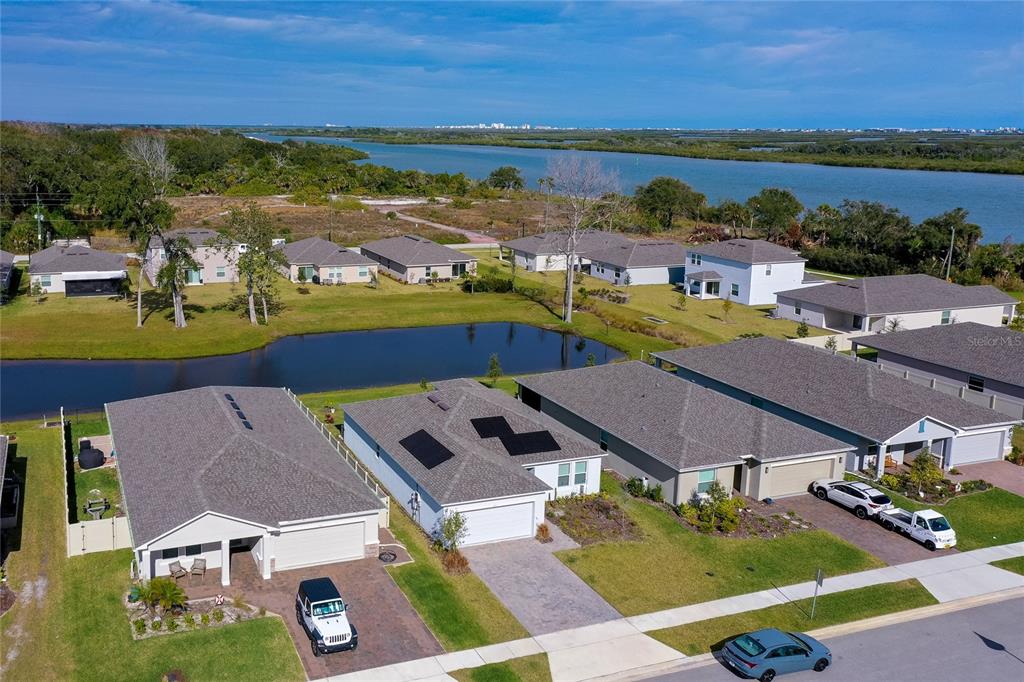 365 River Front Way Edgewater, FL 32141 - Photo 2 of 34 an aerial view of residential houses with outdoor space and ocean view