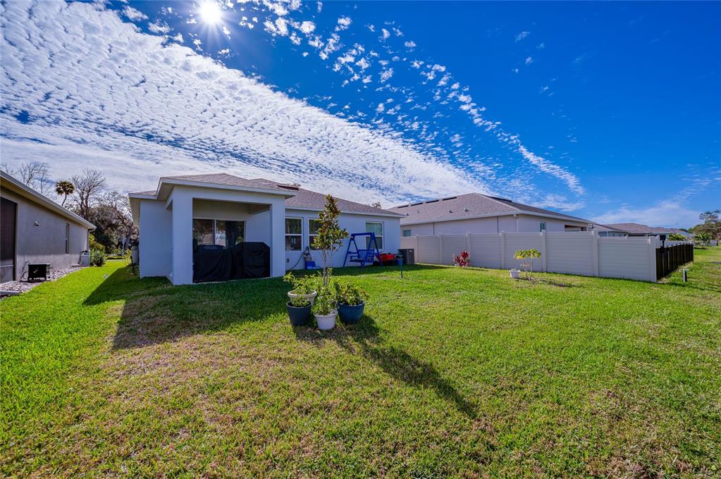 365 River Front Way Edgewater, FL 32141 - Photo 22 of 34 a view of a house with a back yard
