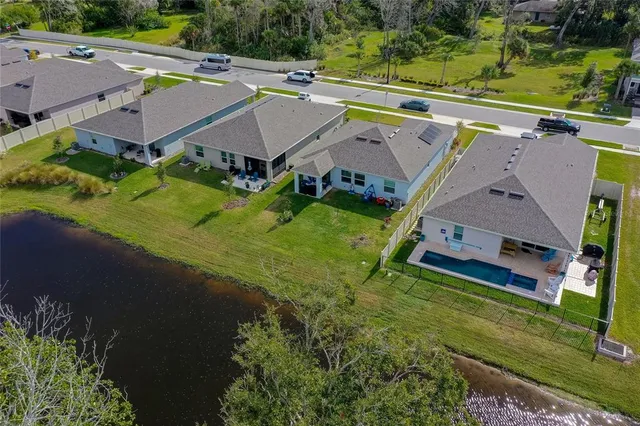 an aerial view of a house with a garden