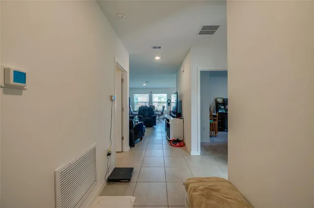 a bathroom with a tub shower and a sink