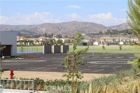 a view of a town with mountains in the background