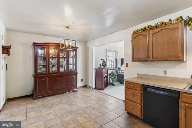 a kitchen with stainless steel appliances granite countertop a stove cabinets and a refrigerator