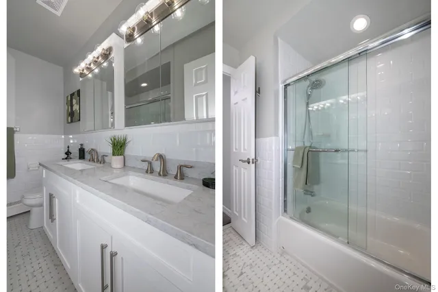 a bathroom with a granite countertop sink a mirror and a bathtub