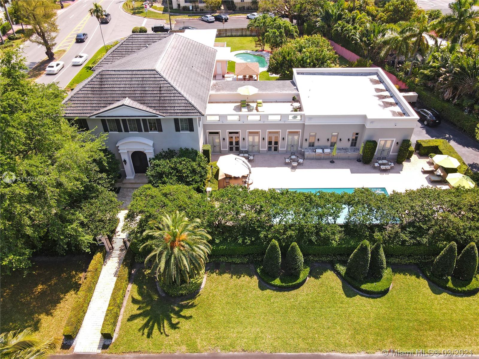 3014 Pine Tree Drive Miami Beach, FL 33140 - Photo 1 of 43 a aerial view of a house with swimming pool garden and patio