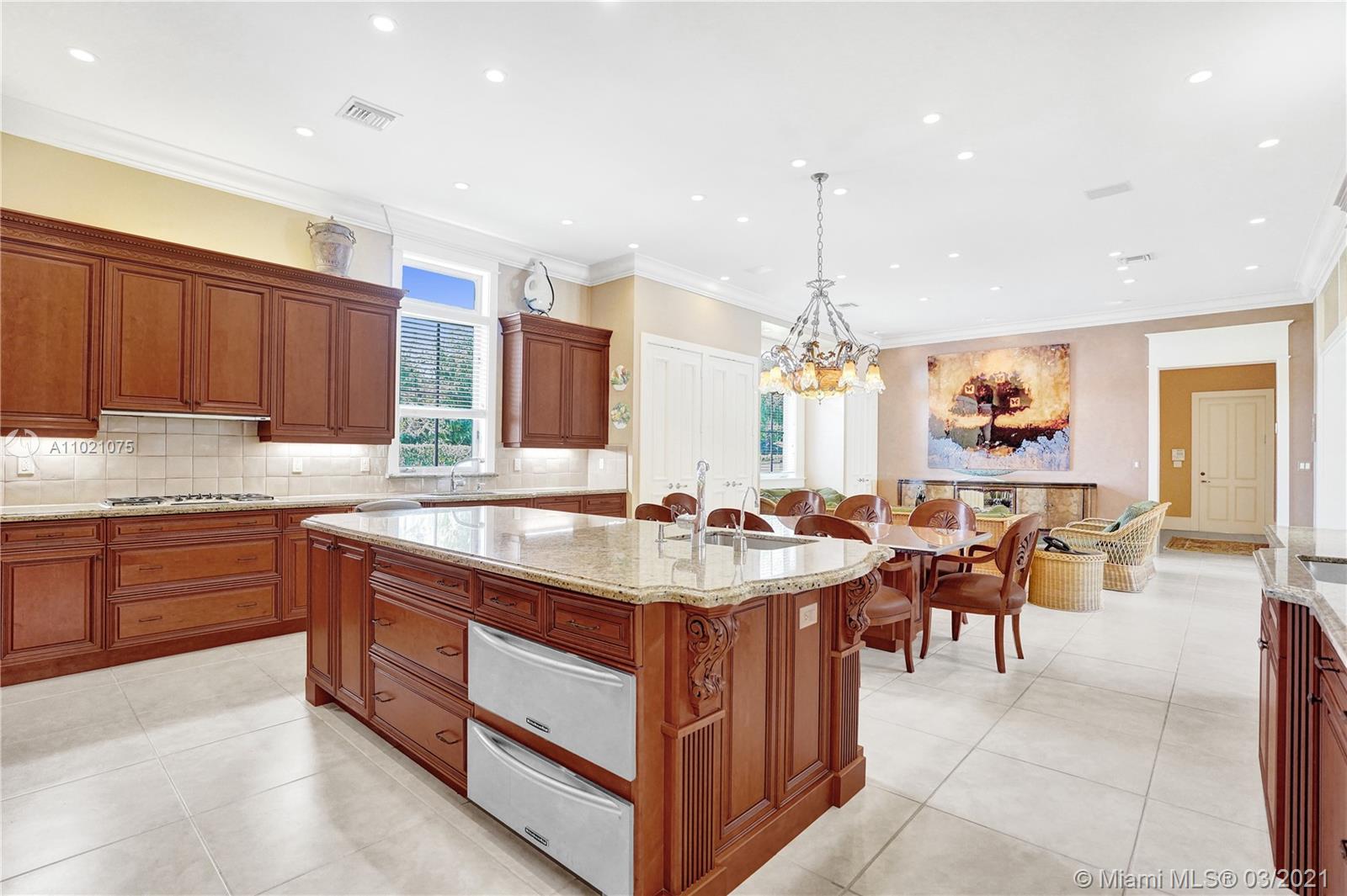 3014 Pine Tree Drive Miami Beach, FL 33140 - Photo 11 of 43 a kitchen with sink and cabinets