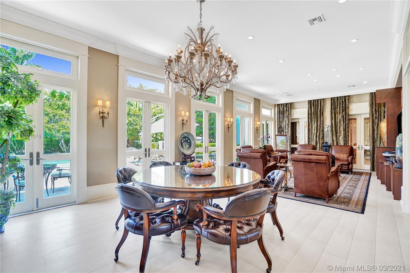 3014 Pine Tree Drive Miami Beach, FL 33140 - Photo 13 of 43 a view of a dining room with furniture window and wooden floor
