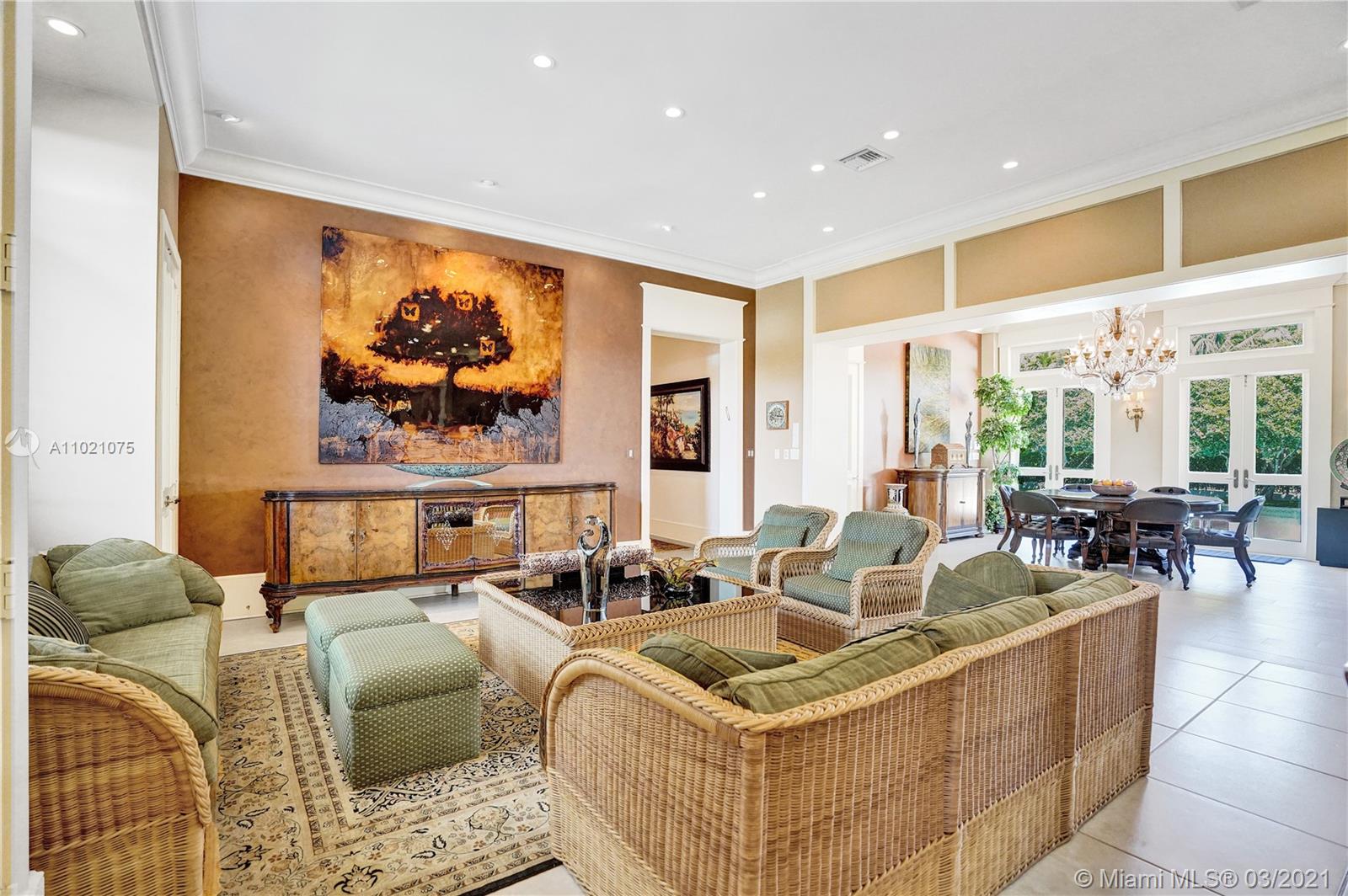 3014 Pine Tree Drive Miami Beach, FL 33140 - Photo 14 of 43 a view of living room with furniture and window