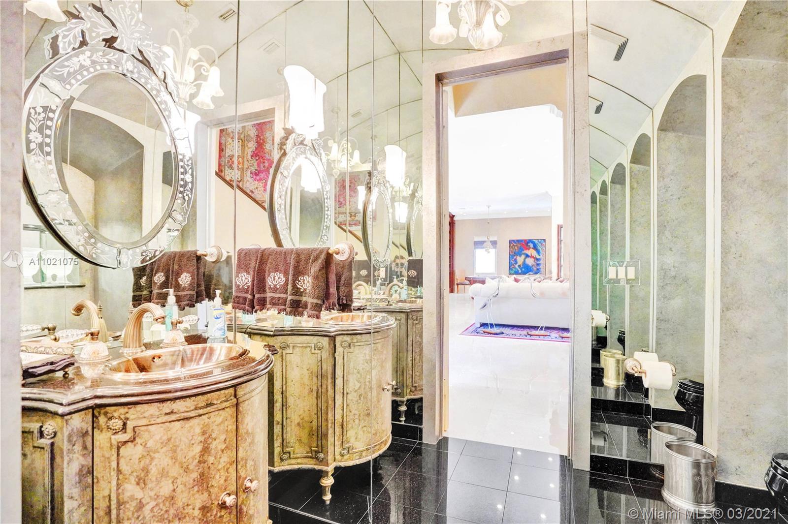 3014 Pine Tree Drive Miami Beach, FL 33140 - Photo 16 of 43 a kitchen with a sink and cabinets