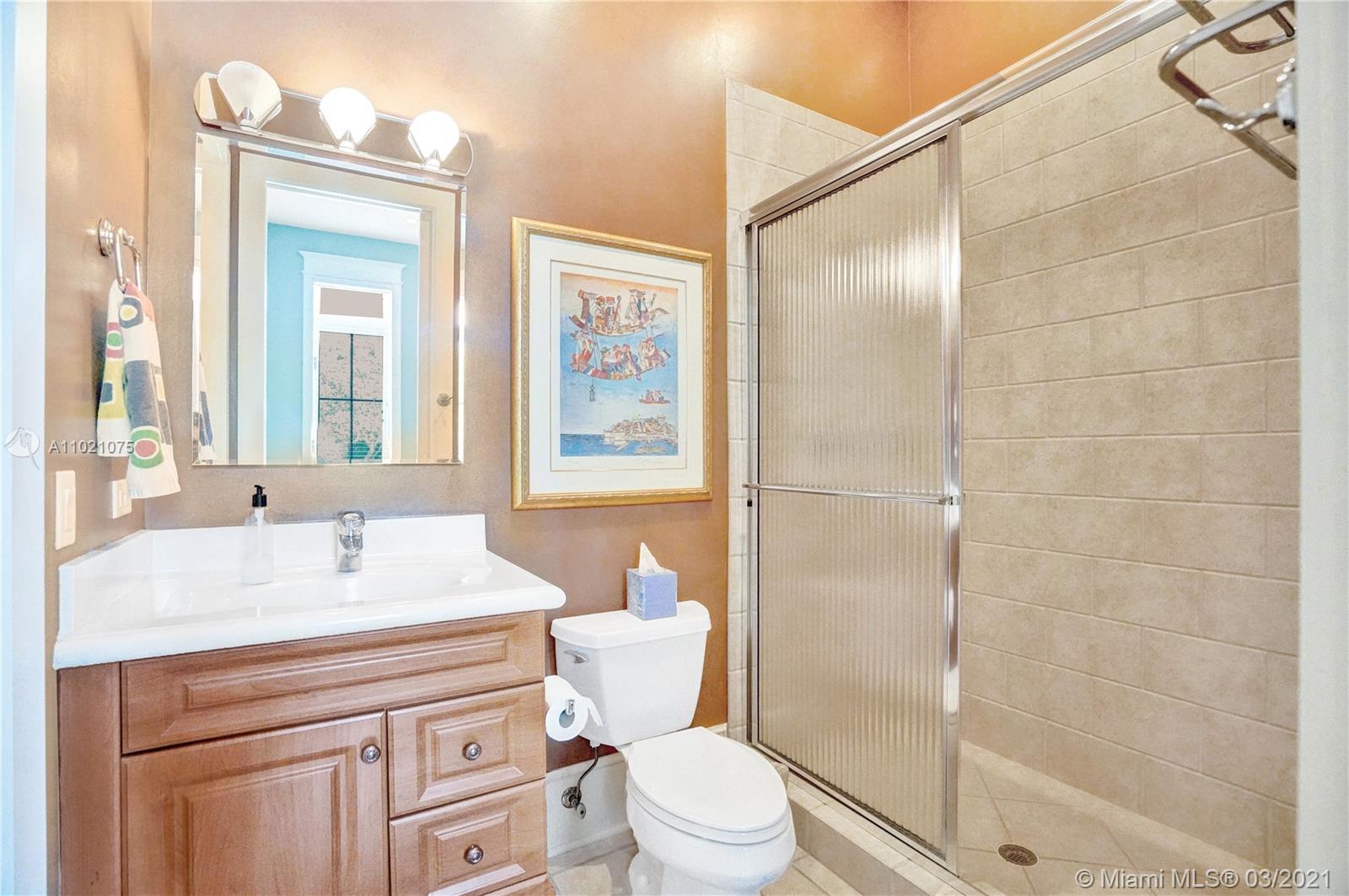3014 Pine Tree Drive Miami Beach, FL 33140 - Photo 20 of 43 a bathroom with a sink a toilet and shower
