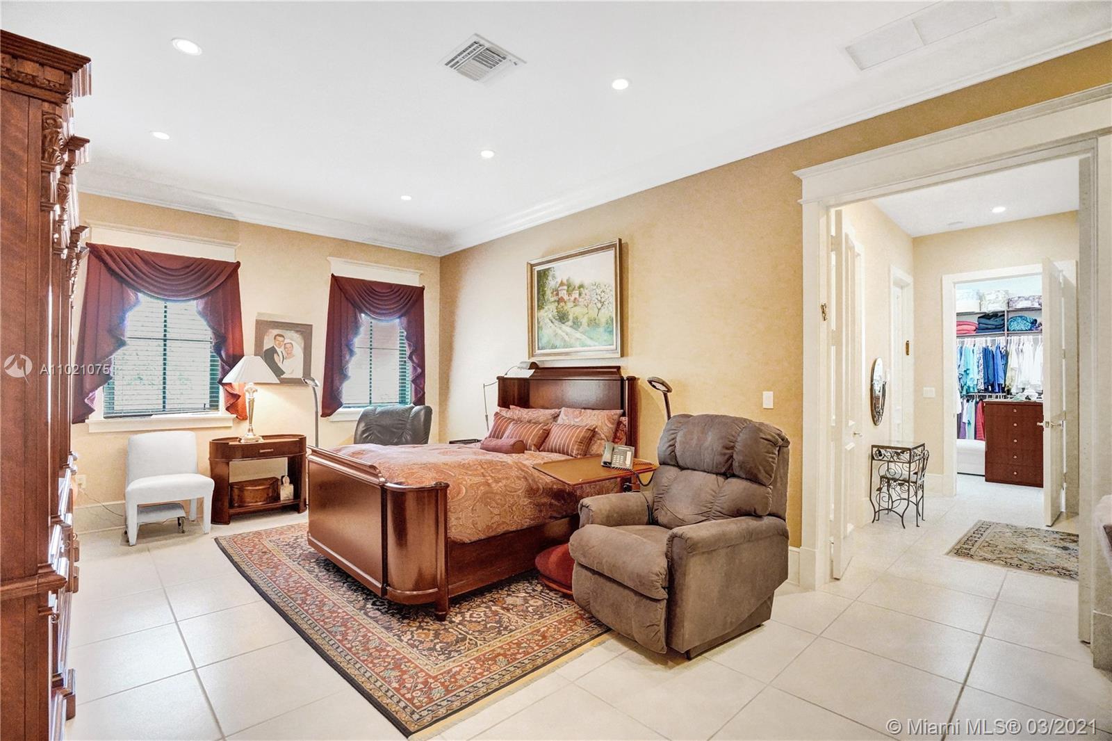 3014 Pine Tree Drive Miami Beach, FL 33140 - Photo 24 of 43 a living room with furniture and a large window